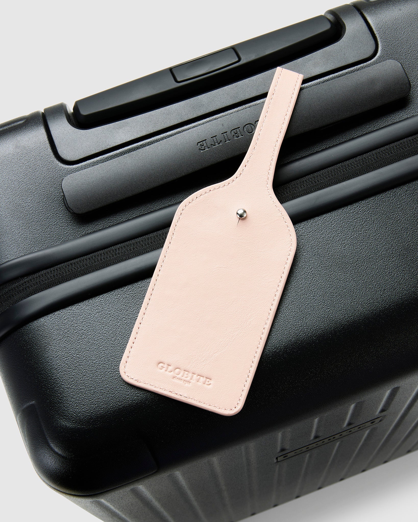 Leather Luggage Tag Brush Pink on Suitcase